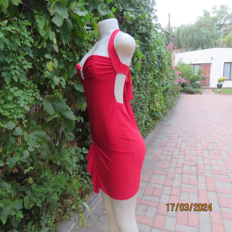 Red polyester stretch evening short dress size 34. Decorated. Long straps to tie.