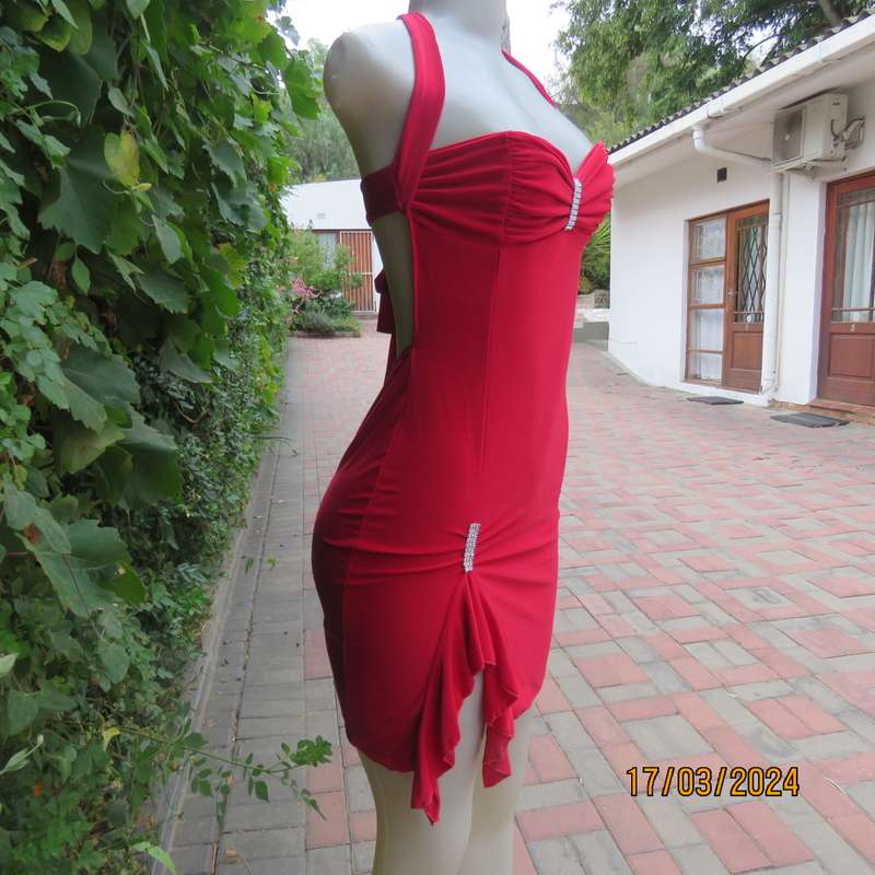 Red polyester stretch evening short dress size 34. Decorated. Long straps to tie.