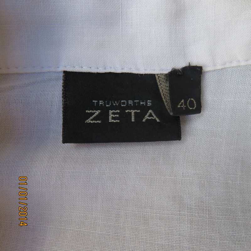 ZETA white 100% ramie slip over top with V and collar. Black embroidery. Size 40