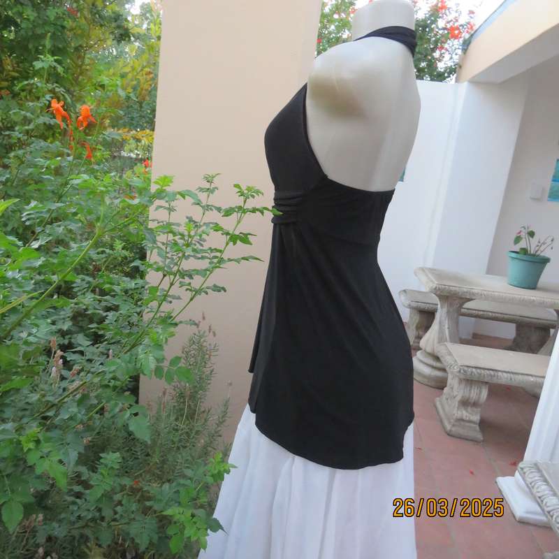 Very black stretch polyester halter neck evening top. Gathered front band with buckle. Size 30