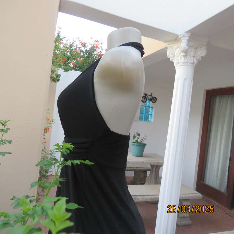 Very black stretch polyester halter neck evening top. Gathered front band with buckle. Size 30