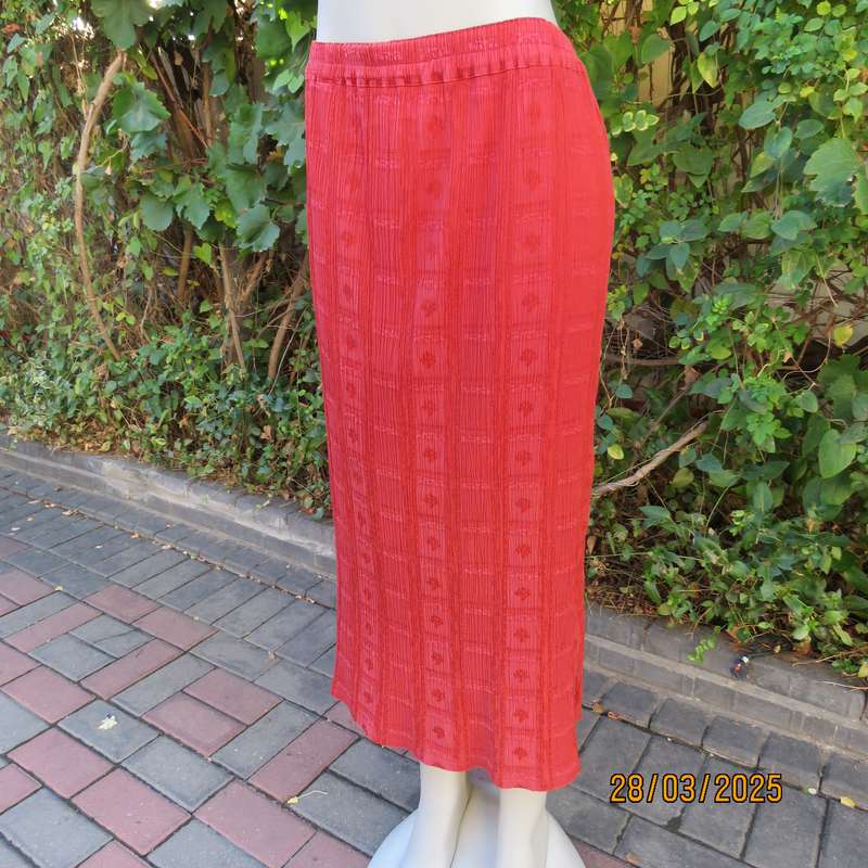 Burnt orange colour ankle length crinkled polycotton size 36 skirt with  embossed patterns.