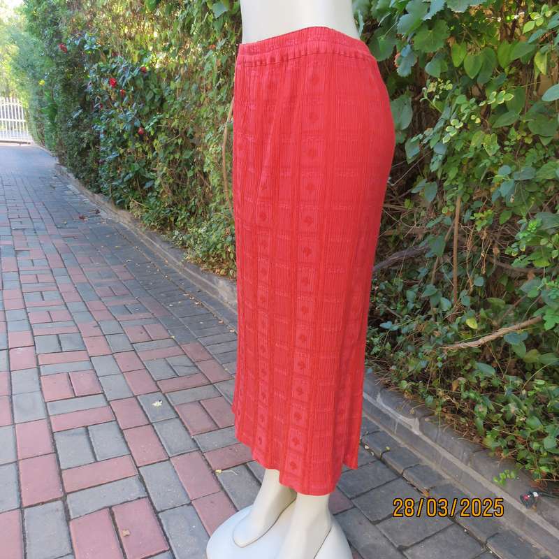 Burnt orange colour ankle length crinkled polycotton size 36 skirt with  embossed patterns.