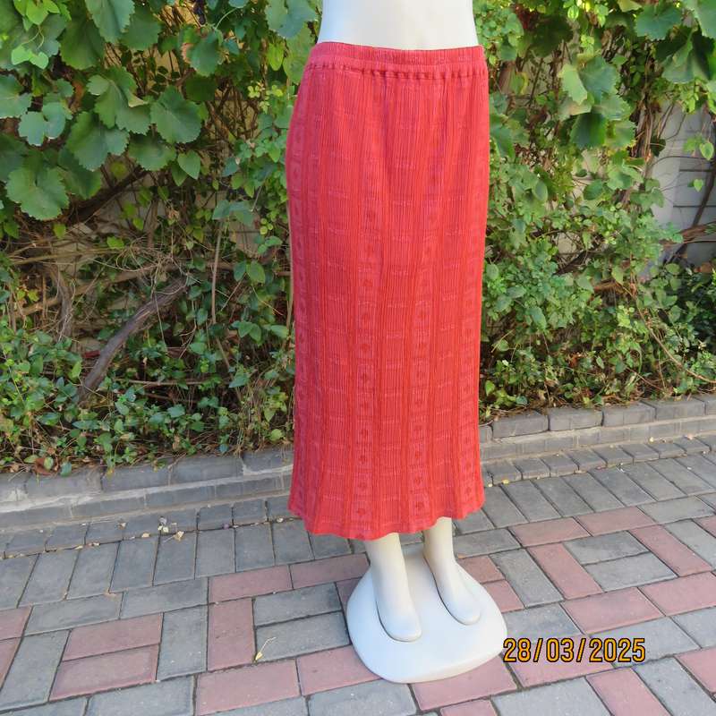 Burnt orange colour ankle length crinkled polycotton size 36 skirt with  embossed patterns.