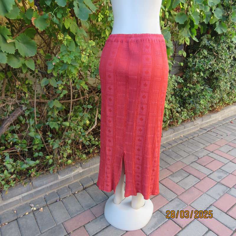 Burnt orange colour ankle length crinkled polycotton size 36 skirt with  embossed patterns.