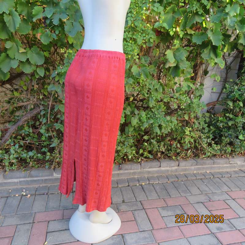 Burnt orange colour ankle length crinkled polycotton size 36 skirt with  embossed patterns.