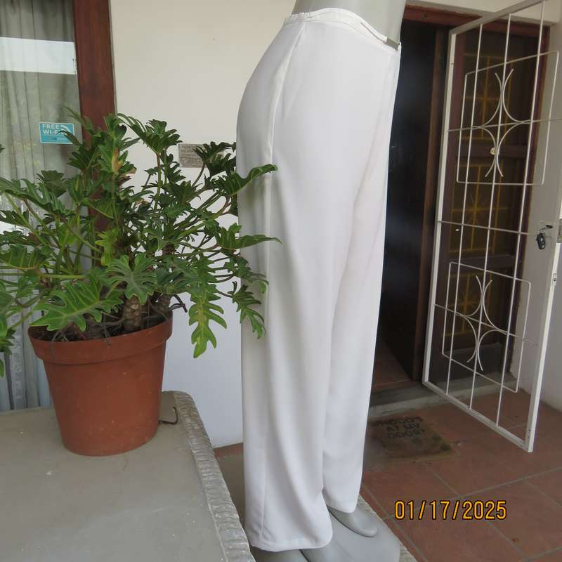 Amazing light cream dress pants with straight legs size 34. Narrow waistband. Zip at back. As new