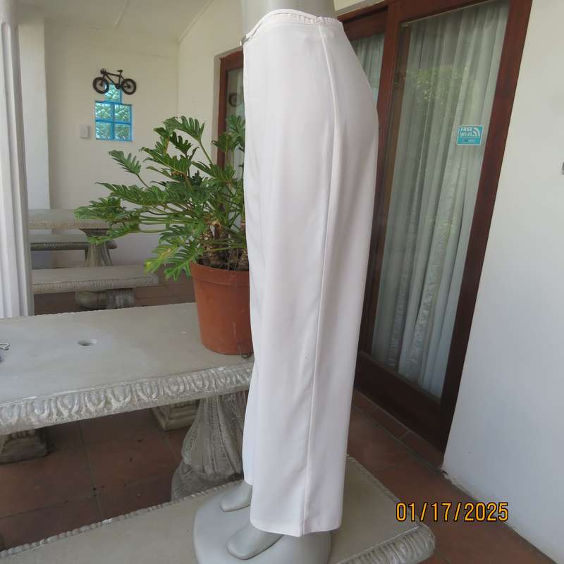 Amazing light cream dress pants with straight legs size 34. Narrow waistband. Zip at back. As new