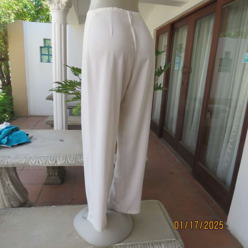 Amazing light cream dress pants with straight legs size 34. Narrow waistband. Zip at back. As new