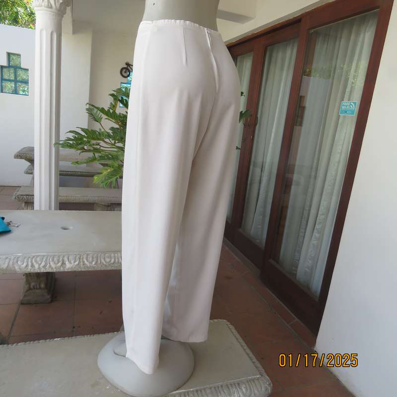 Amazing light cream dress pants with straight legs size 34. Narrow waistband. Zip at back. As new