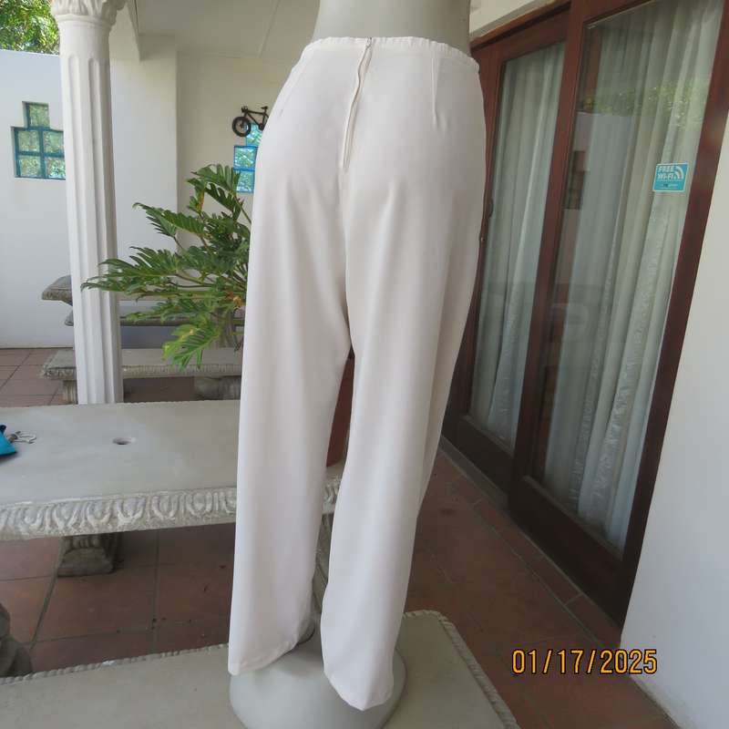 Amazing light cream dress pants with straight legs size 34. Narrow waistband. Zip at back. As new