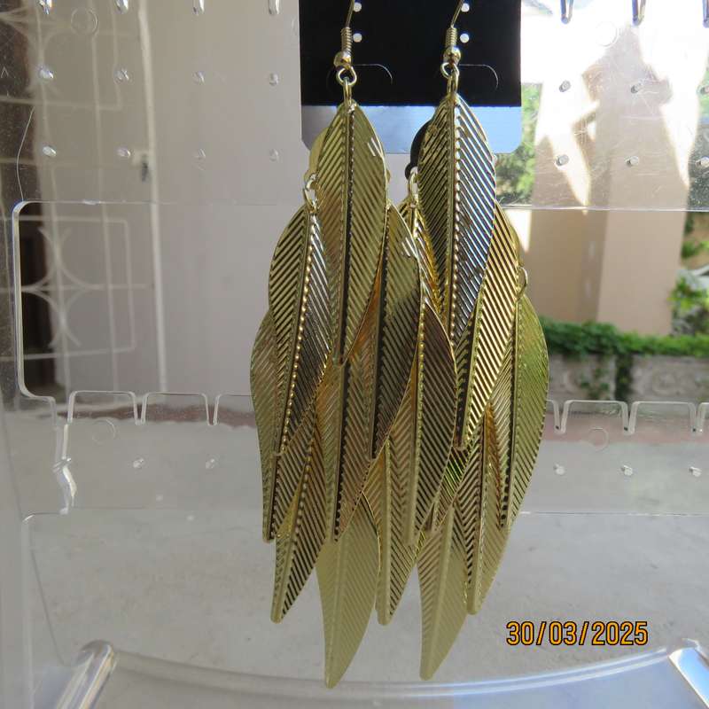 Pair golden long light weight multi leaf earrings. New item.