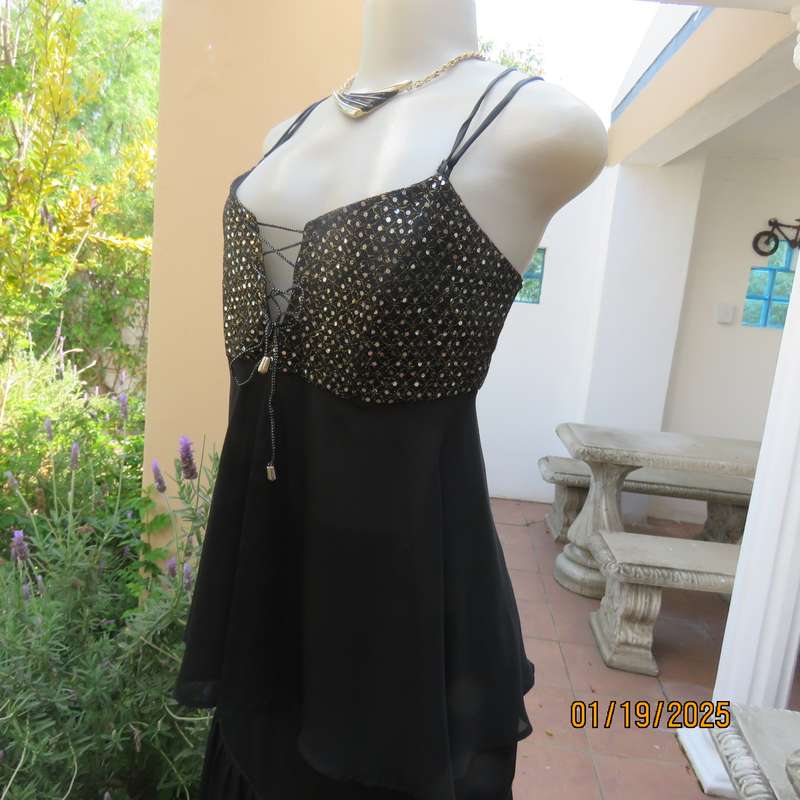 Sexy black polyester evening top with sequined bodice.Empire style. Size 34.Shoulder straps.As new