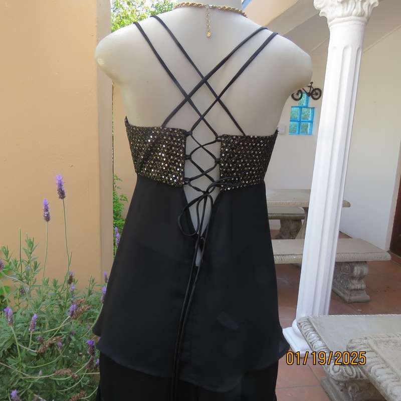 Sexy black polyester evening top with sequined bodice.Empire style. Size 34.Shoulder straps.As new