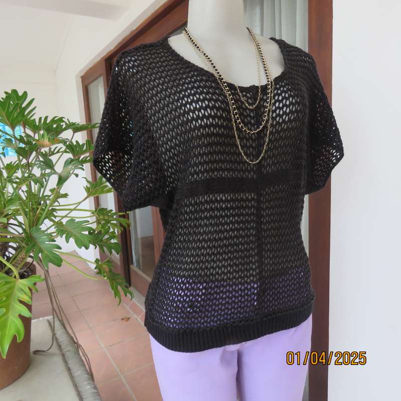 Charming black cotton knit slip over top with tiny knit-on sleeves. Size 36.