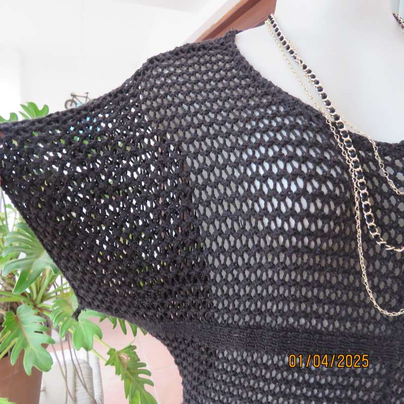 Charming black cotton knit slip over top with tiny knit-on sleeves. Size 36.