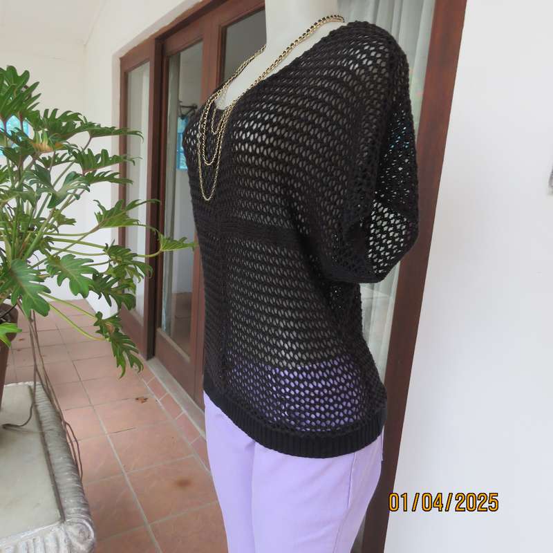 Charming black cotton knit slip over top with tiny knit-on sleeves. Size 36.