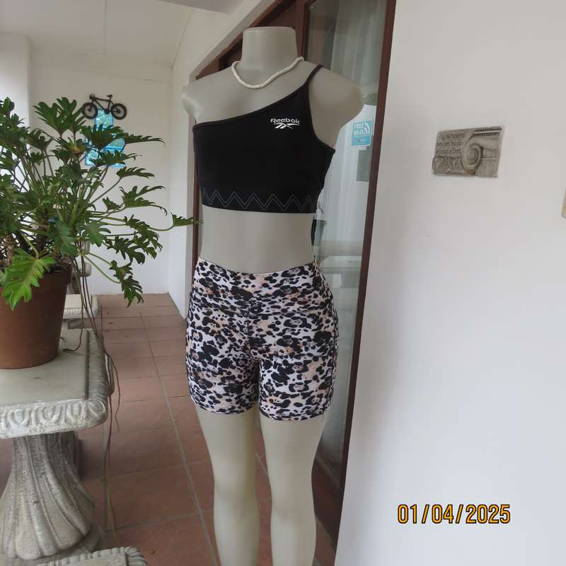 REEBOK black stretch sport top size 30-32. One shoulder strap. As new