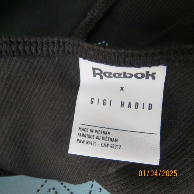 REEBOK black stretch sport top size 30-32. One shoulder strap. As new
