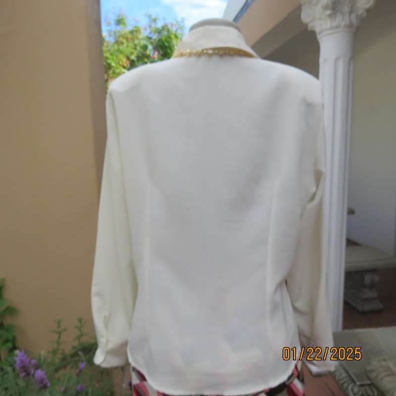Smart light cream long cuffed sleeve polyester top size 38-40. Hidden button down.Open collar.As new