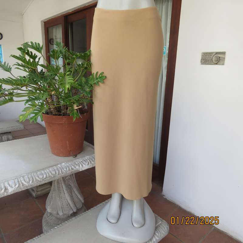 EXACT camel sleek ankle length bandless skirt in polyester-rayon stretch fabric. Size 34.As new cond