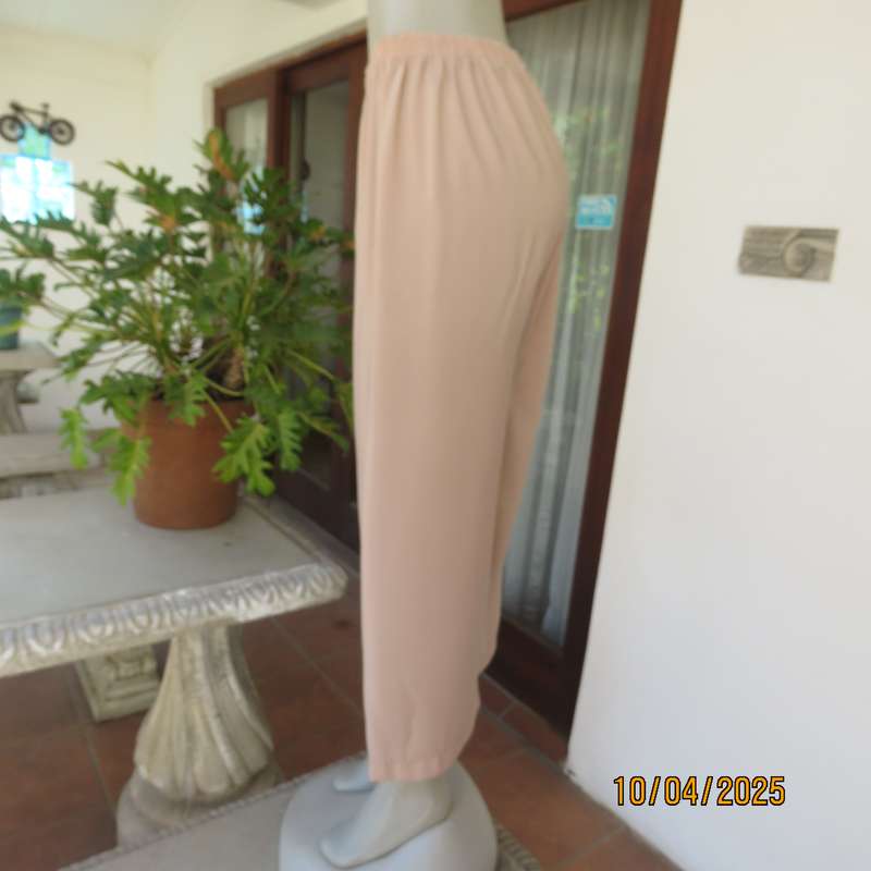 Rich cream silky polyester ankle length pants with elasticated waist. Size 40.