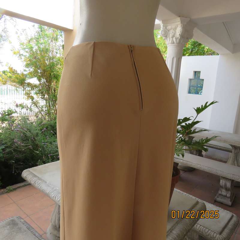 EXACT camel sleek ankle length bandless skirt in polyester-rayon stretch fabric. Size 34.As new cond