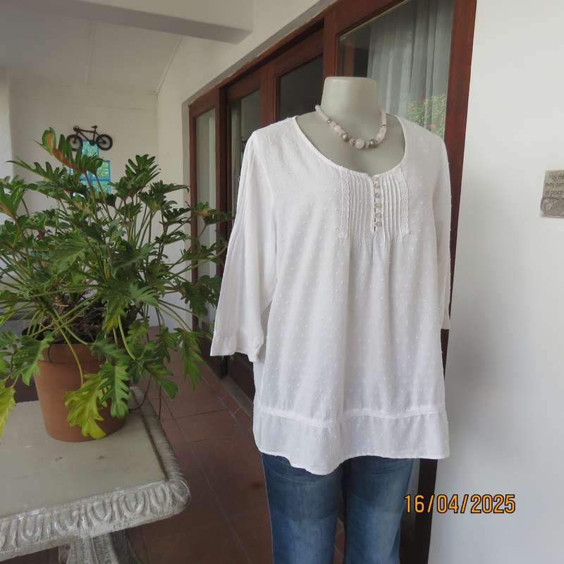 White swiss dot cotton slip over size 42 top with elbow length sleeves.