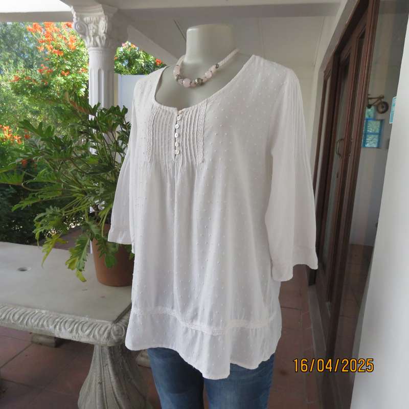 White swiss dot cotton slip over size 42 top with elbow length sleeves.