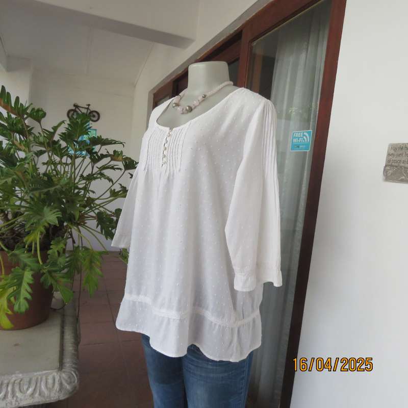 White swiss dot cotton slip over size 42 top with elbow length sleeves.