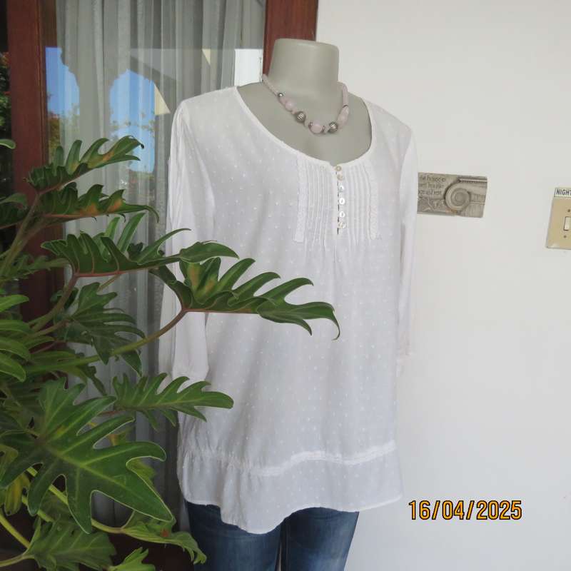 White swiss dot cotton slip over size 42 top with elbow length sleeves.