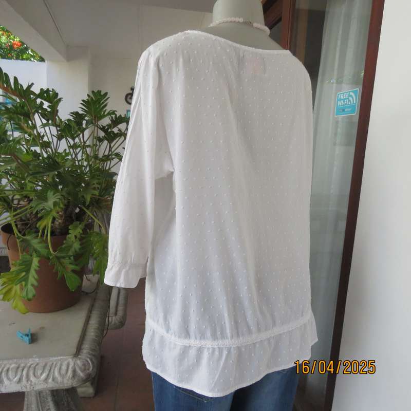 White swiss dot cotton slip over size 42 top with elbow length sleeves.