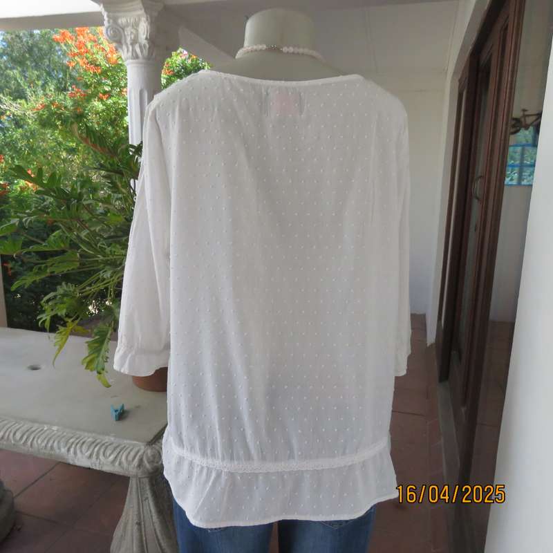 White swiss dot cotton slip over size 42 top with elbow length sleeves.