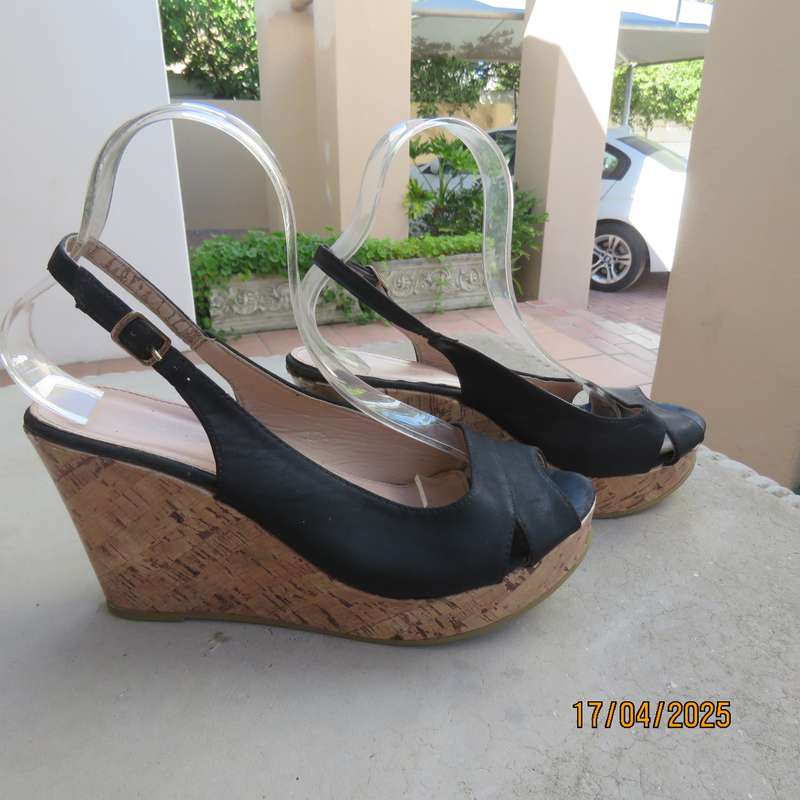 Black faux leather open toe sandals with cork wedge heels size 8. Good Cond.