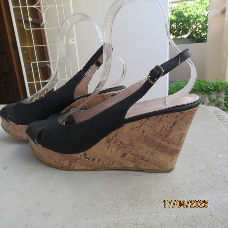 Black faux leather open toe sandals with cork wedge heels size 8. Good Cond.