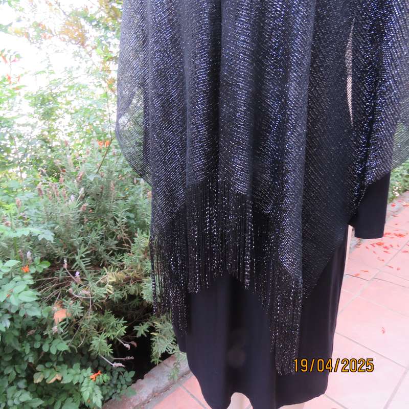 Luxury black polyester throw with silver thread with V front. New item