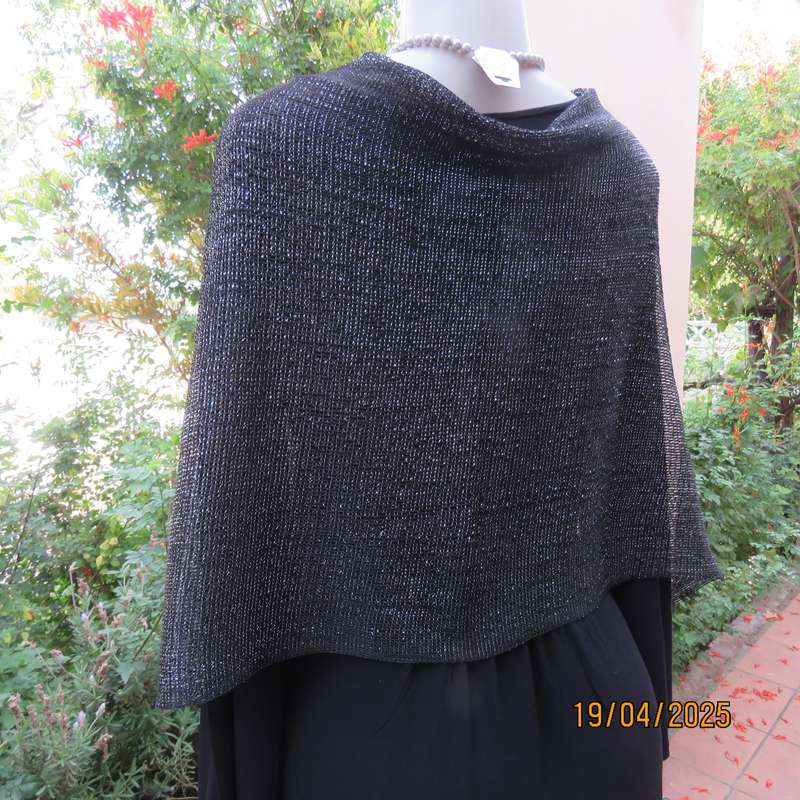 Luxury black polyester throw with silver thread with V front. New item