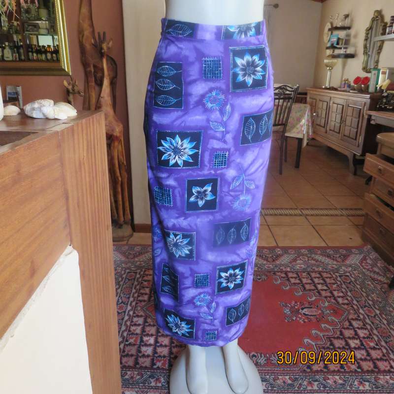 Sleek viscose ankle length viscose skirt in eyecatching purple black and blue pattern.Size 32.As new