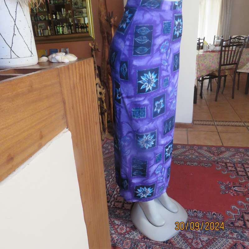 Sleek viscose ankle length viscose skirt in eyecatching purple black and blue pattern.Size 32.As new