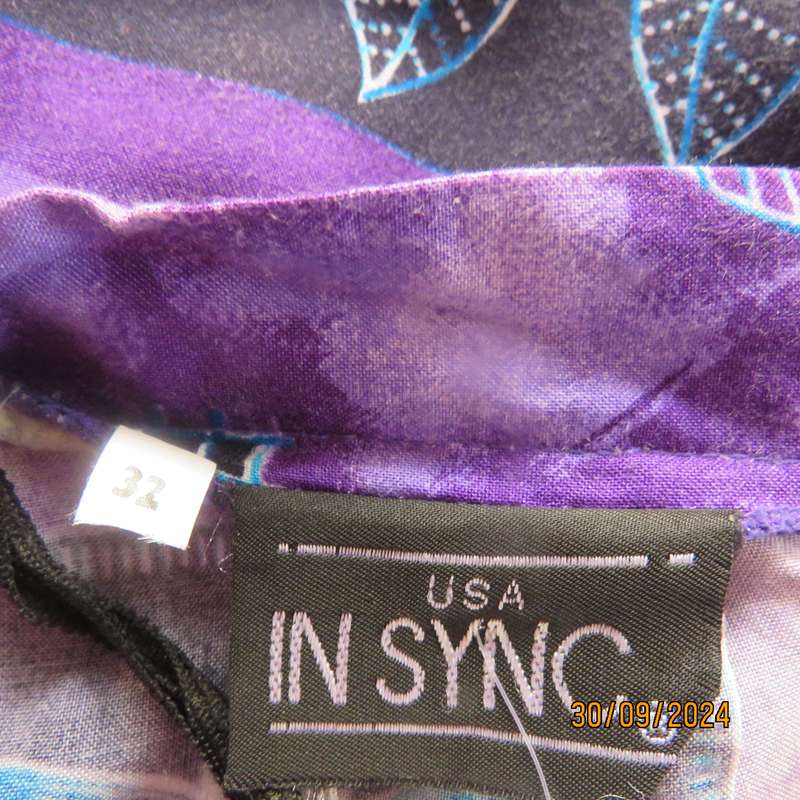 Sleek viscose ankle length viscose skirt in eyecatching purple black and blue pattern.Size 32.As new