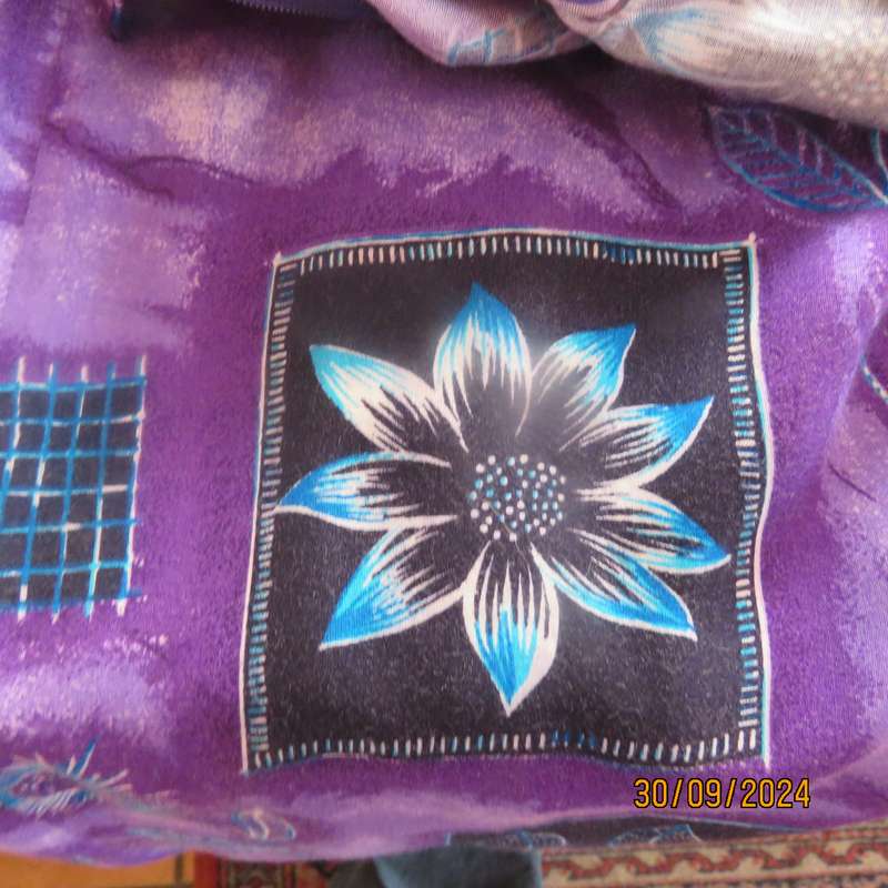 Sleek viscose ankle length viscose skirt in eyecatching purple black and blue pattern.Size 32.As new