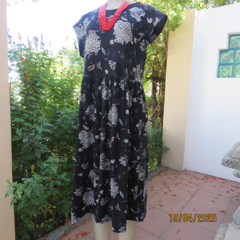 Black very soft stretch polyester with white flowers maternity size 36-38 dress.