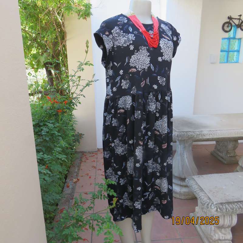 Black very soft stretch polyester with white flowers maternity size 36-38 dress.