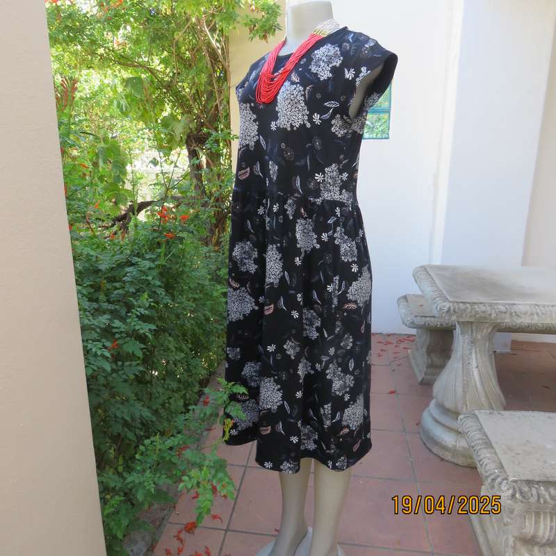 Black very soft stretch polyester with white flowers maternity size 36-38 dress.