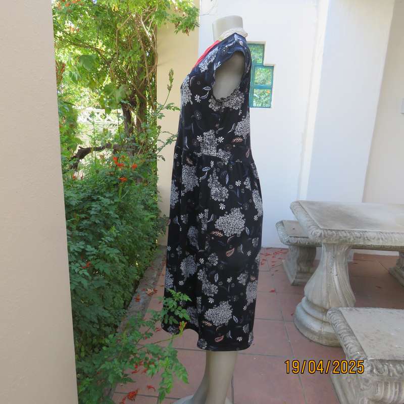Black very soft stretch polyester with white flowers maternity size 36-38 dress.