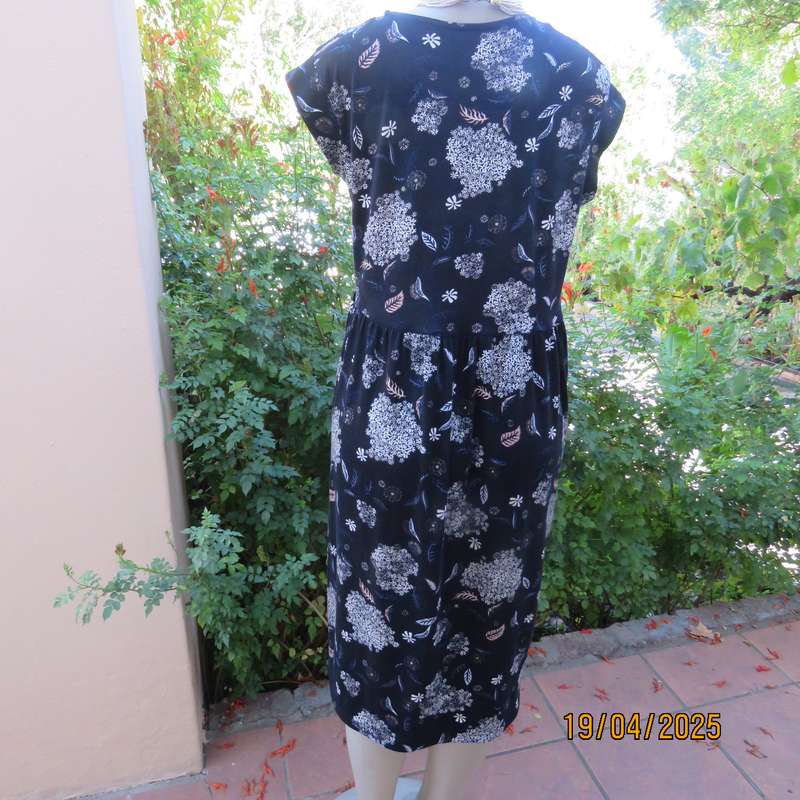 Black very soft stretch polyester with white flowers maternity size 36-38 dress.