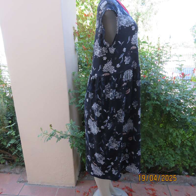 Black very soft stretch polyester with white flowers maternity size 36-38 dress.