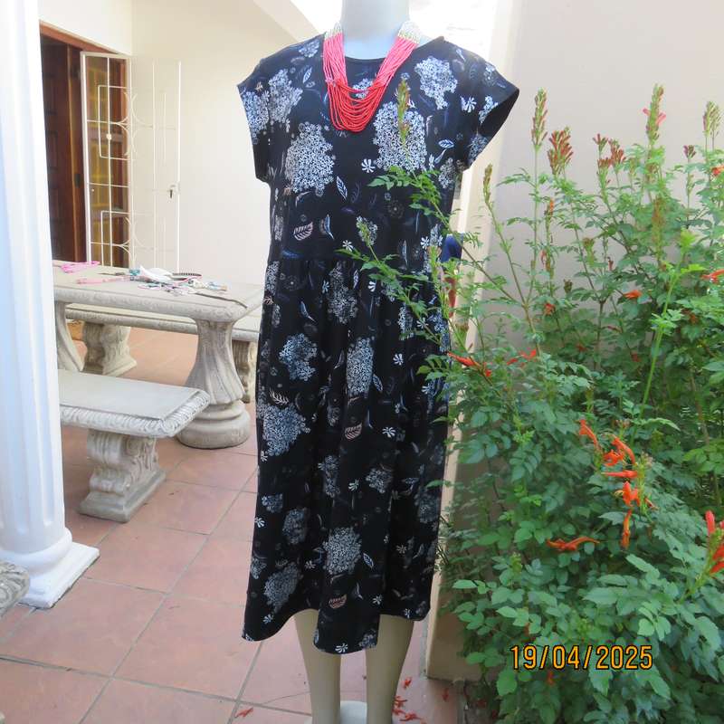 Black very soft stretch polyester with white flowers maternity size 36-38 dress.