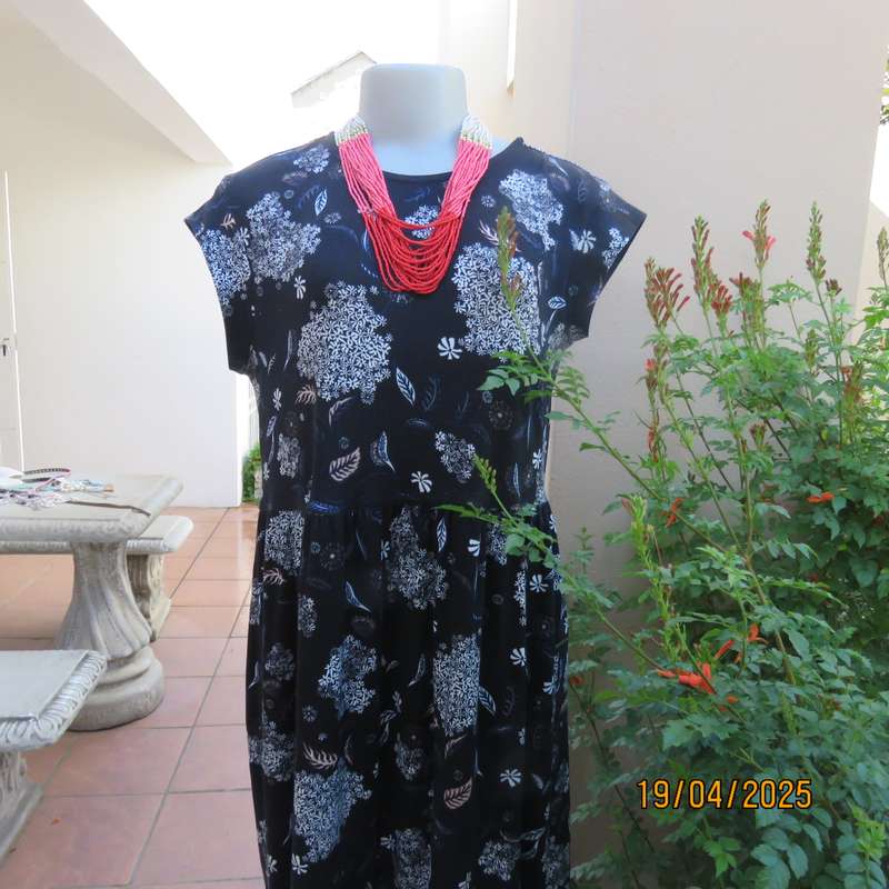 Black very soft stretch polyester with white flowers maternity size 36-38 dress.