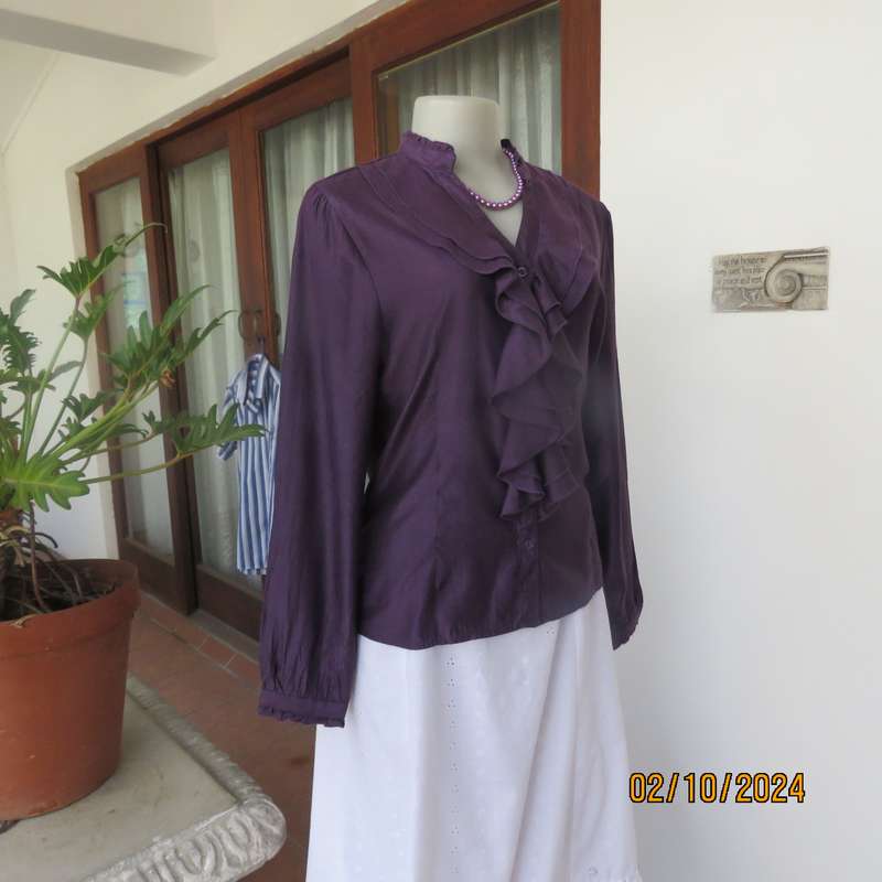 Smart shiny dark purple long sleeve tailored top size 34. V front with banded neckline.As new cond.